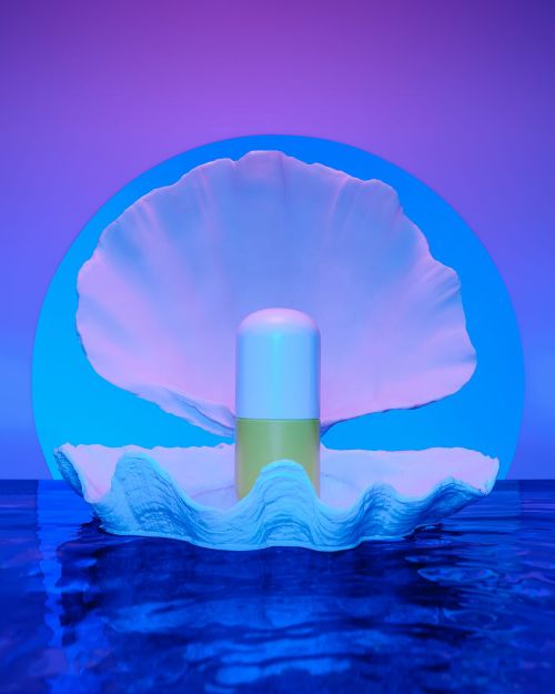 Conceptual art rendering: a stylized pearl in an oyster shell over water, bathed in vibrant blue and purple hues.