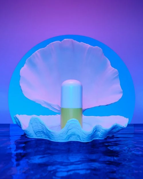 Conceptual art rendering: a stylized pearl in an oyster shell over water, bathed in vibrant blue and purple hues.