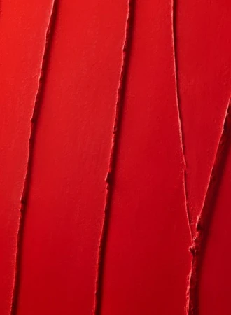 Close-up shot of red lipstick with linear textured swipes and glossy finish, ideal for beauty, makeup, or cosmetic product promotion.