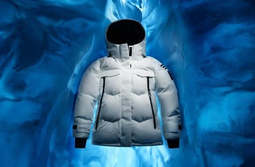 White hooded puffer jacket on display against blue background. Winter fashion advertisement. Apparel product shot.