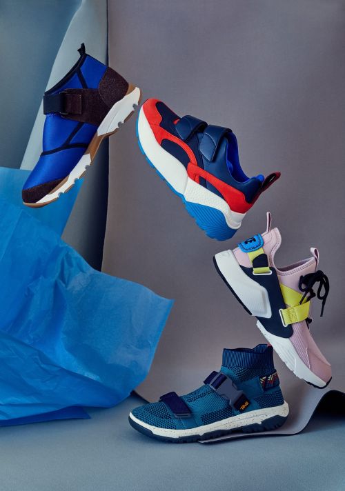 Five athletic sneakers arranged in a dynamic composition, showcasing a variety of designs and vibrant color combinations against a neutral backdrop.