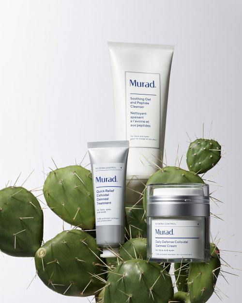 Three Murad skincare products displayed with a prickly pear cactus against a white background in a beauty product shot.