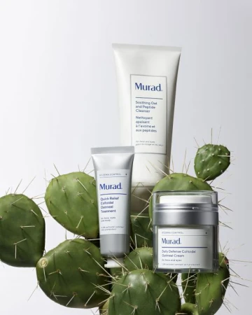 Three Murad skincare products displayed with a prickly pear cactus against a white background in a beauty product shot.