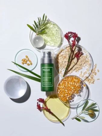 Cosmetic product Retinol Skin Renewel Serum by Murad sits alongside raw grains, kernels, olive oil, and botanical elements.