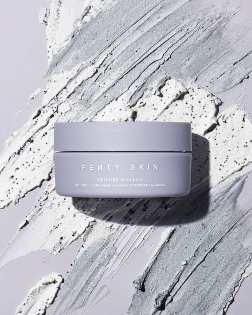 Fenty Skin Cookies N Clean face mask jar against a textured gray and white cosmetic product background. Beauty shot. 