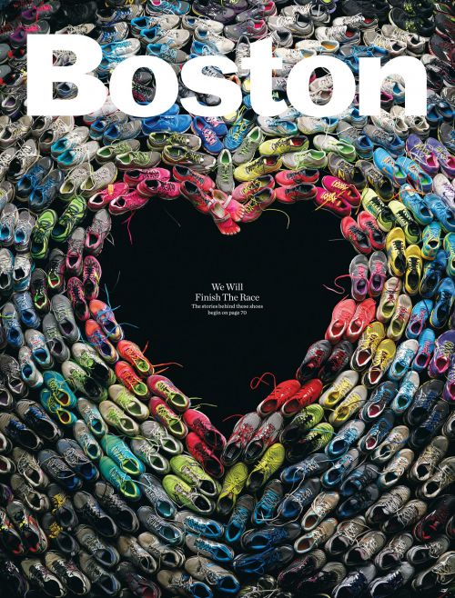 Overhead shot of running shoes arranged in a heart shape, surrounded by more shoes, with the word 'Boston' and the tagline 'We Will Finish The Race'.