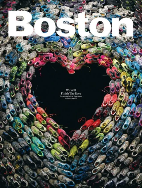 Overhead shot of running shoes arranged in a heart shape, surrounded by more shoes, with the word 'Boston' and the tagline 'We Will Finish The Race'.