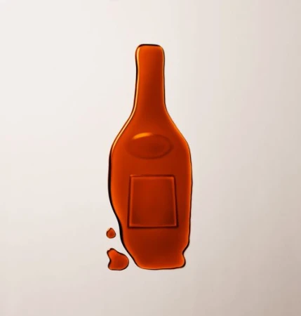 Caramel-colored wax seal resembling a wine bottle on a light background, suggesting a product or brand related to beverages.