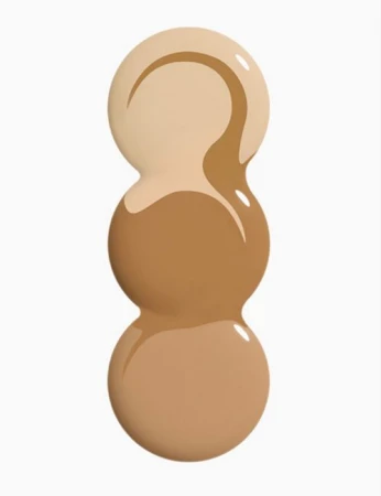 Three stacked drops of different shades of liquid foundation, ranging from light beige to medium tan, on a white background.