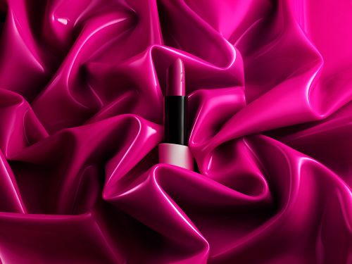 Close-up of a lipstick tube on shiny fuchsia fabric, showcasing makeup, beauty, and product photography with a high-fashion aesthetic.