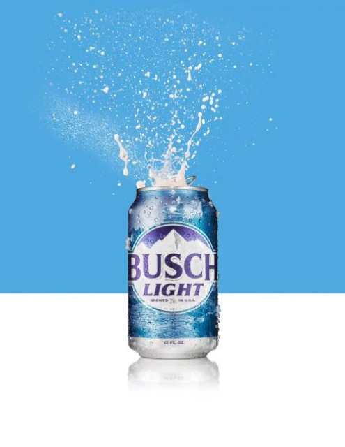 Icy Busch Light beer can with a splash on a blue and white background. Refreshing beverage advertisement on a bright studio background.