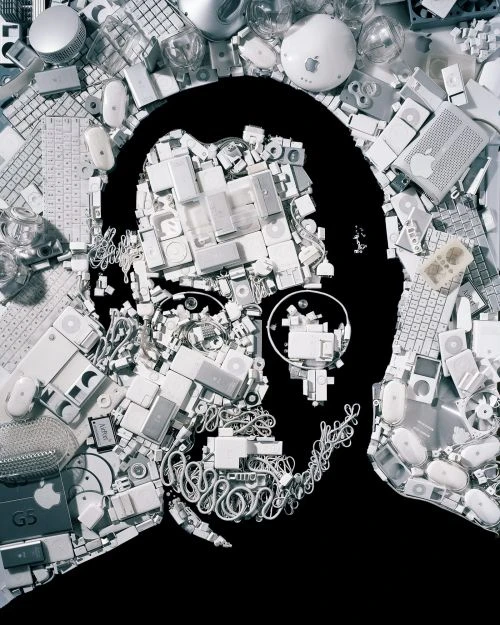 Conceptual image of Steve Jobs' silhouette filled with Apple computer hardware, keyboards, mice, and cables on a black background.