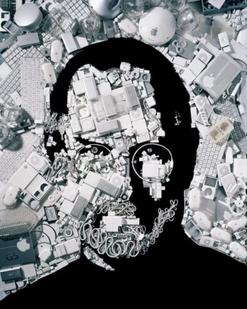Conceptual image of Steve Jobs' silhouette filled with Apple computer hardware, keyboards, mice, and cables on a black background.