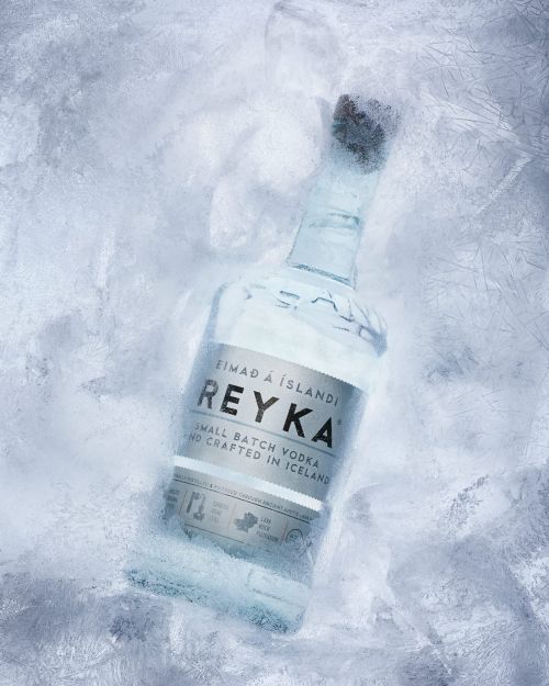 Reyka Icelandic vodka bottle stands out against a frosty backdrop, elegantly showcasing the brand's commitment to purity and craftsmanship.