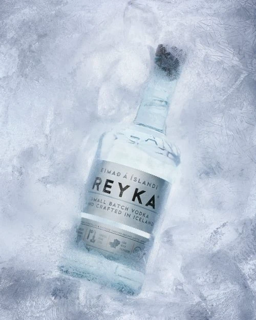 Reyka Icelandic vodka bottle stands out against a frosty backdrop, elegantly showcasing the brand's commitment to purity and craftsmanship.