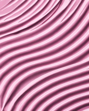 Close-up shot of wavy pink fabric creating a soft, elegant texture and pattern, ideal for backgrounds or abstract visuals.