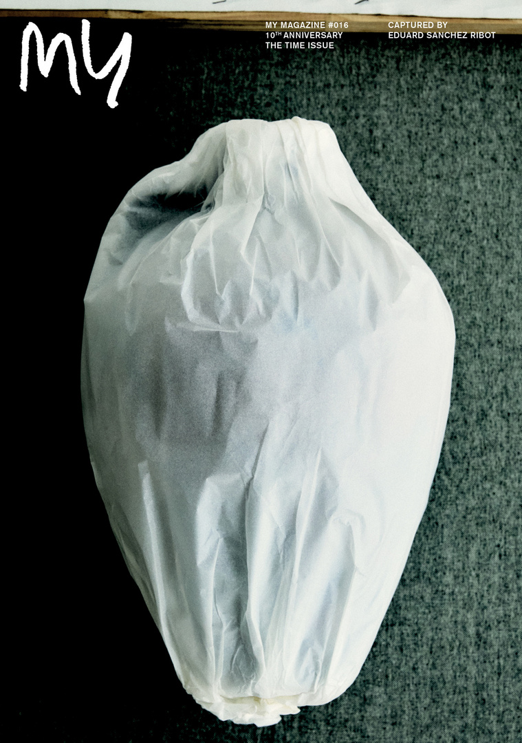Magazine cover featuring a wrapped vase against a textured gray background with bold white title text, and publishing details.