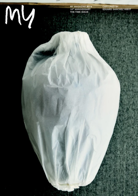 Magazine cover featuring a wrapped vase against a textured gray background with bold white title text, and publishing details.