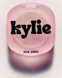 Pink frosted compact case with rounded corners featuring bold black typography reading kylie and kylie jenner on white background