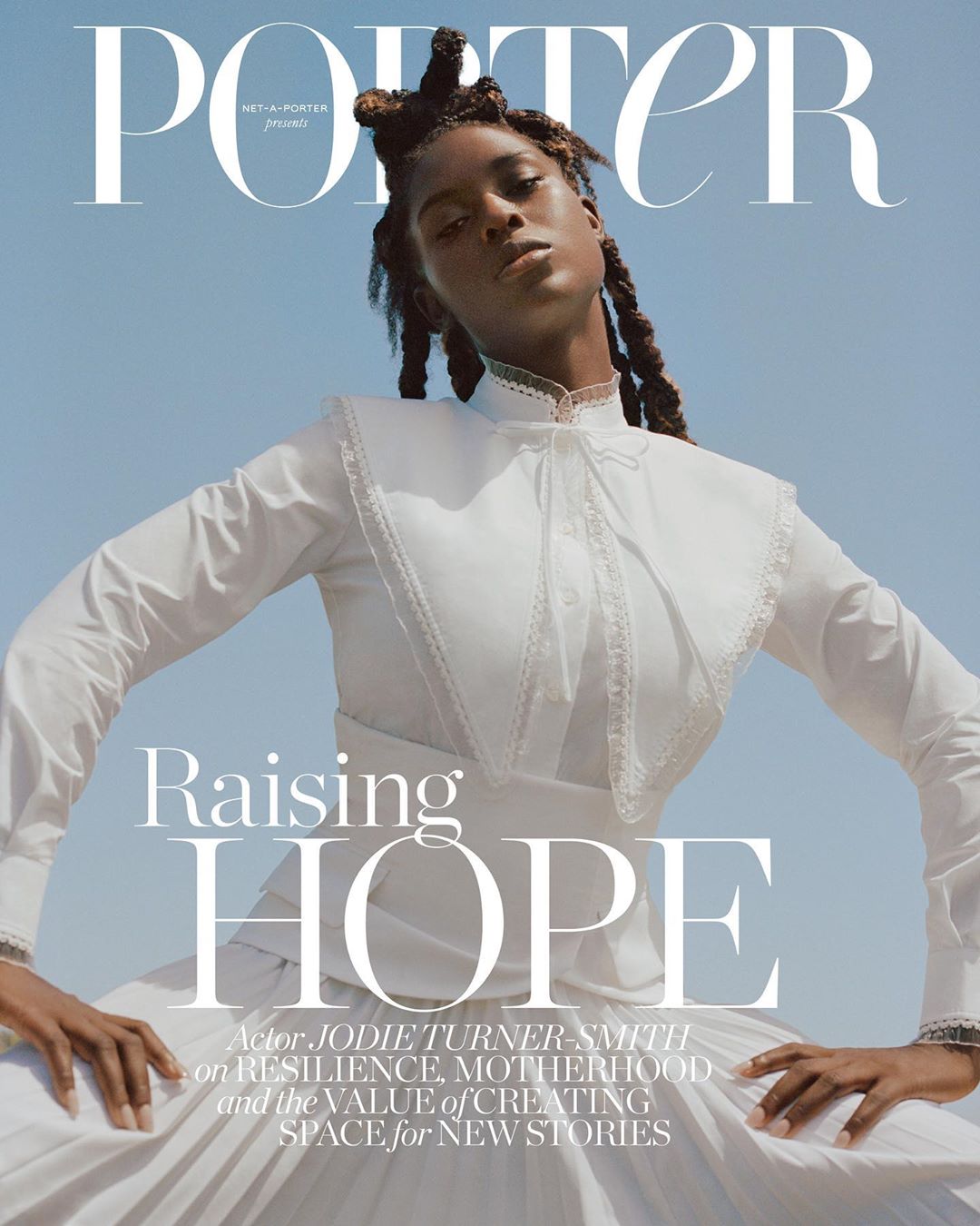 Magazine cover featuring Jodie Turner-Smith in a white dress against a blue sky background, highlighting fashion and celebrity.