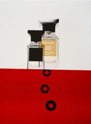 Two perfume bottles positioned against a divided white and red studio background with three floating black hexagonal rings below.