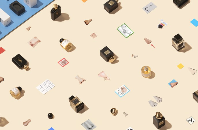 Overhead shot of scattered perfume bottles, boxes, and plastic noses on a light peach and blue background, arranged in a pattern.