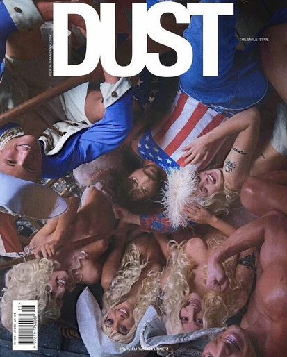 Magazine cover featuring a pile of blonde-haired people, American flag, and a title that reads "DUST", with the subtitle "THE SMILE ISSUE".