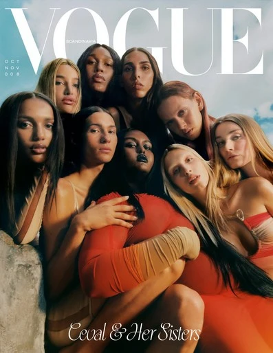 Vogue Scandinavia magazine cover features a group of ten diverse women. The color palette includes neutrals, red, with a blue sky backdrop.