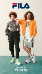 Two models standing on a teal floor against a white background, styled by Cece Liu wearing Fila sportswear and trainers