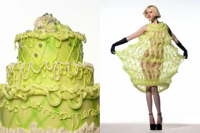 Model wears a green net dress next to a tiered green cake in a studio setting on a white background, fashion and food themes.