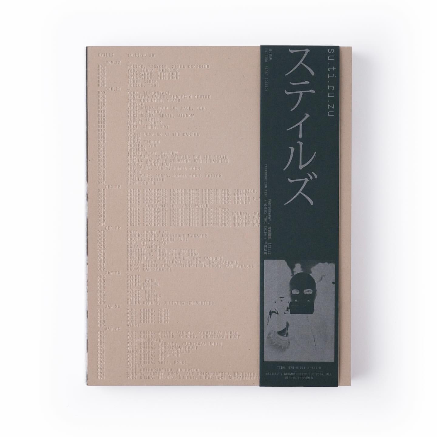 Beige book with an image of a person wearing a balaclava on the cover, set against a white background.