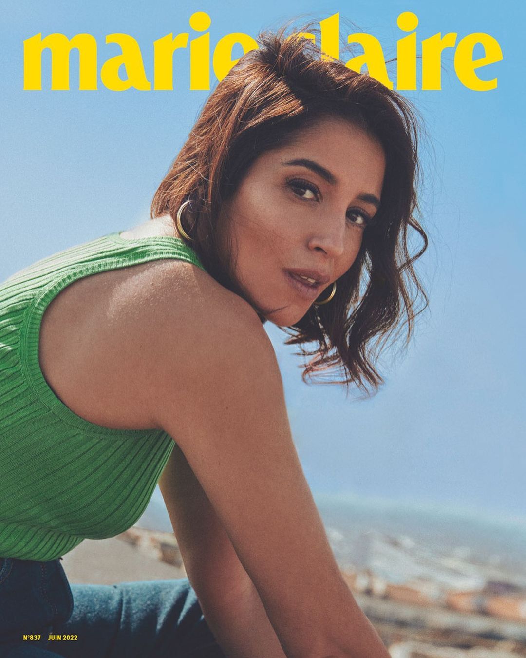 Magazine cover featuring a woman in a green top looking at the camera, with a blue sky background and Marie Claire masthead.