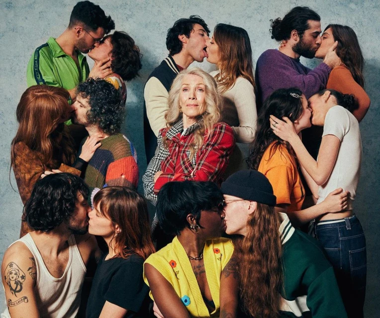 A diverse group of couples kissing, capturing a moment of intimacy and connection with a focus on relationships and human bonds in a studio setting.