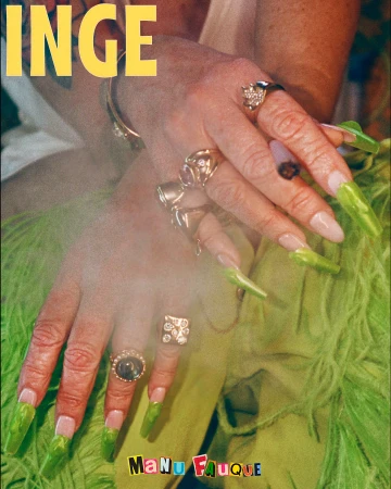 Close-up of hands with long green acrylic nails and gold rings holding a cigarette, wearing green feather clothing