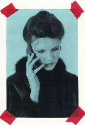 Portrait of a woman talking on a smartphone against a cyan background, framed by red tape on the corners.