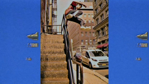 Young man mid-air doing a skateboarding trick over a railing, urban street background with buildings, van, captured with vivid color grading.