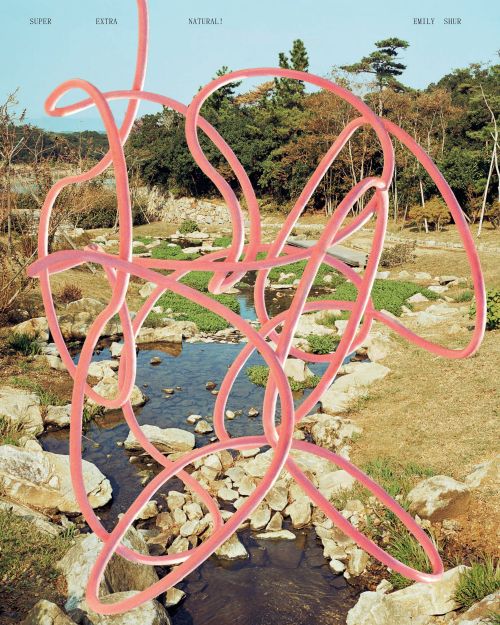 Outdoor scene with a stream, trees, and a pink, looping, 3D-rendered line art element dominating the composition, under a blue sky.