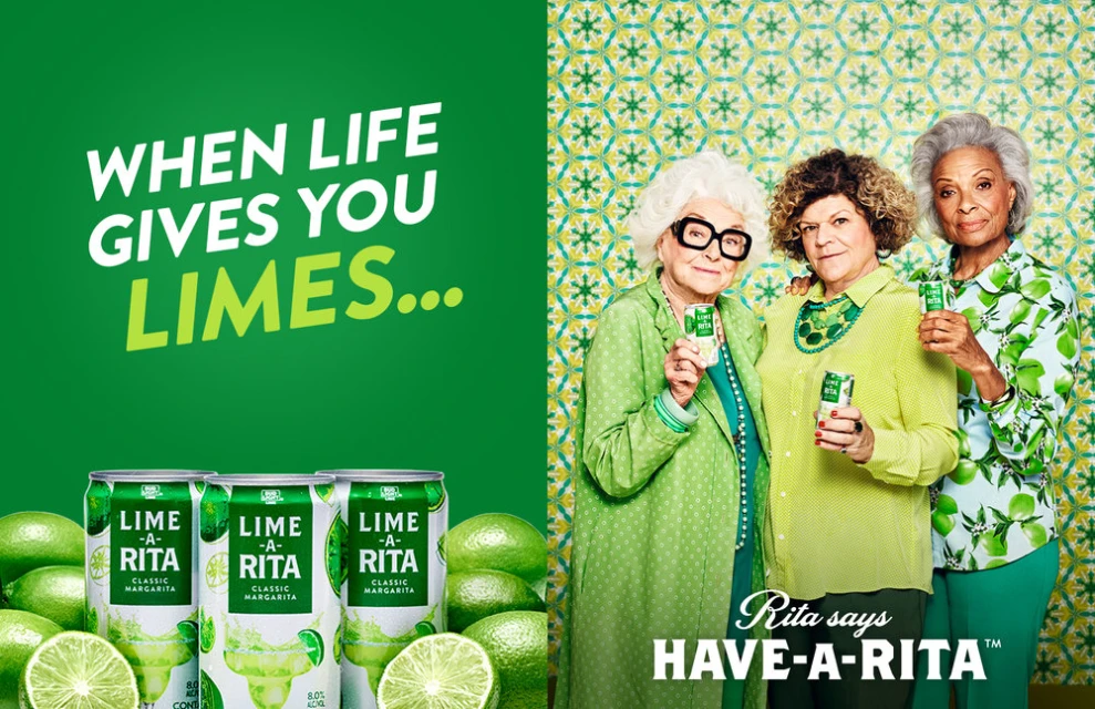 Three elderly women promote Lime-A-Rita in a vibrant, green-themed advertisement. The ad features cans of the beverage and fresh limes.