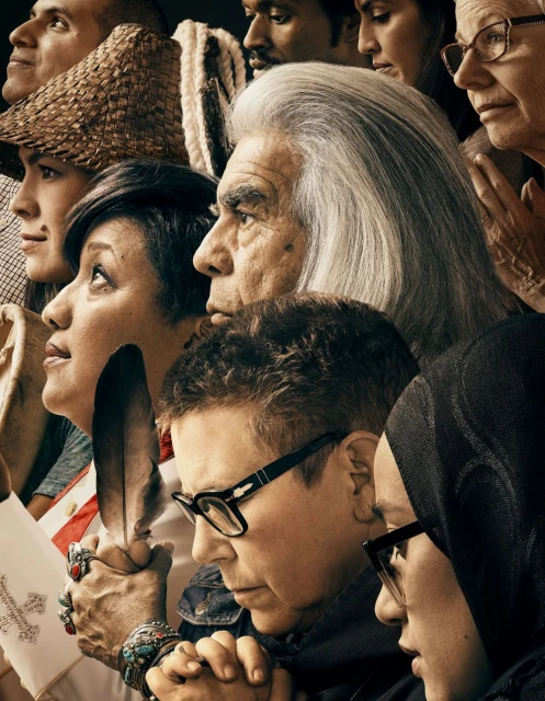 Diverse group of adults in close-up portrait, featuring a variety of ages, ethnicities, and hairstyles, looking upward with serious expressions.