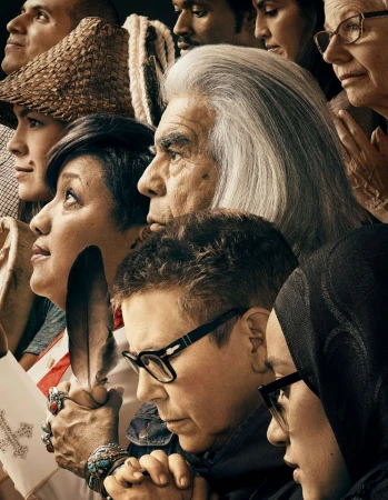 Diverse group of adults in close-up portrait, featuring a variety of ages, ethnicities, and hairstyles, looking upward with serious expressions.