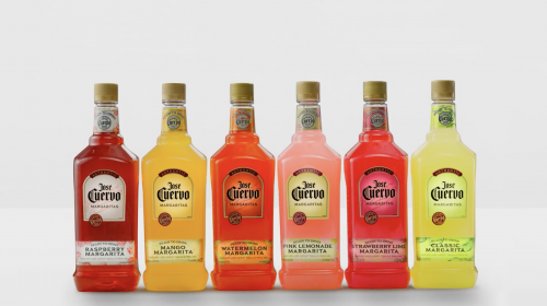 Colorful array of Jose Cuervo Margarita bottles in various fruit flavors: raspberry, mango, watermelon, pink lemonade, strawberry lime, classic.