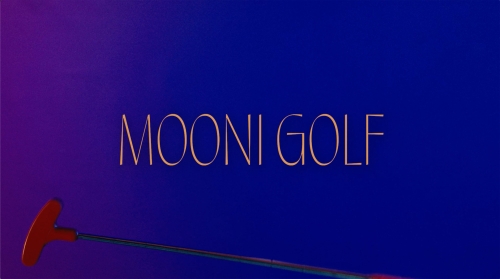 Minimalist studio shot of a red and silver golf putter against a gradient blue background with 'MOONI GOLF' in tan text.
