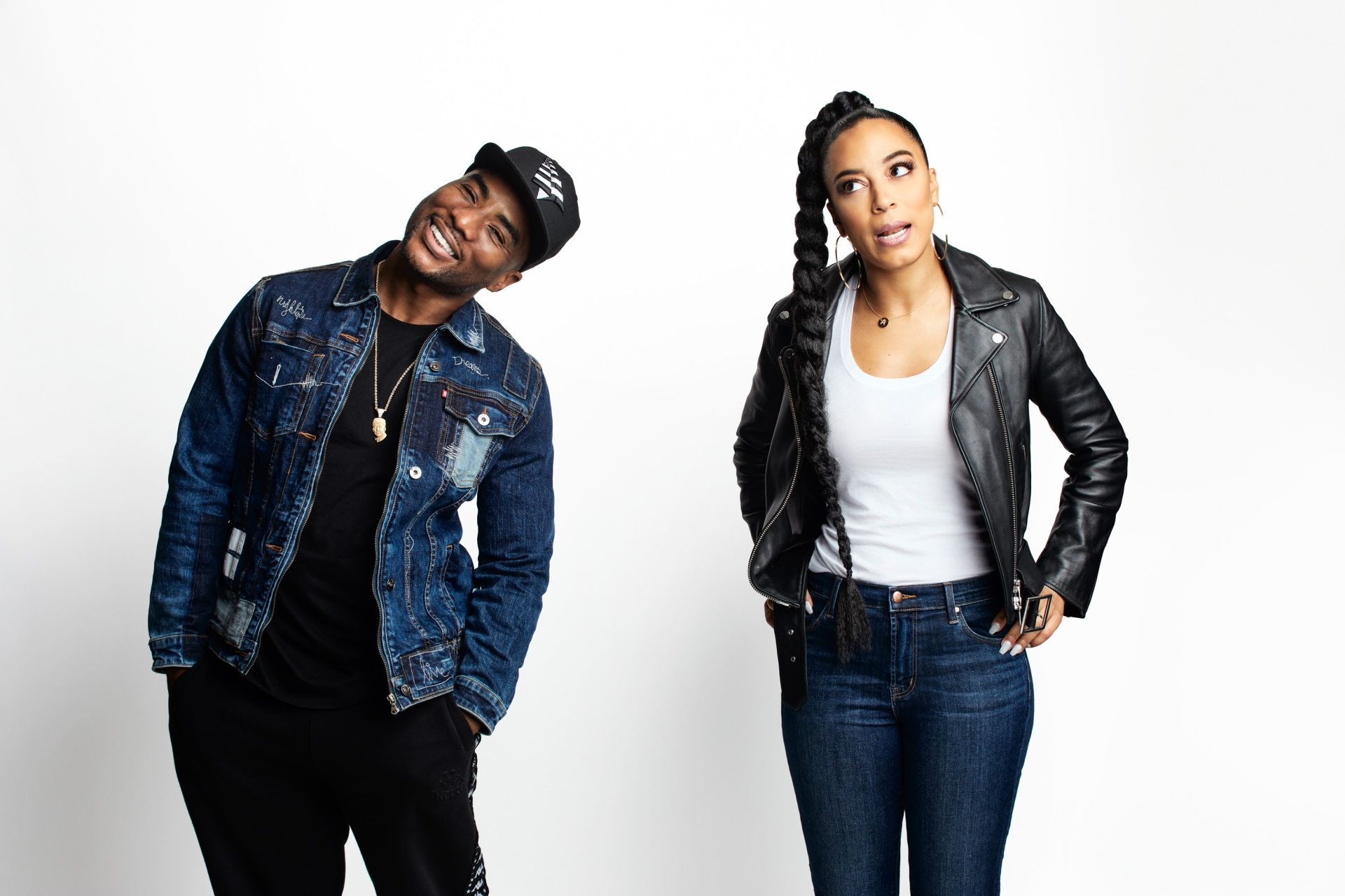 Portrait of a Black man in a denim jacket and cap next to a Black woman in a leather jacket against a white background.