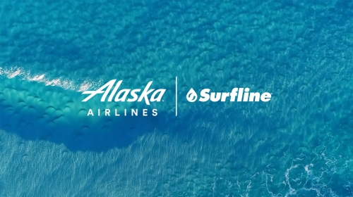 Aerial view of ocean waves with white logos for Alaska Airlines and Surfline, creating an image for travel or surfing.