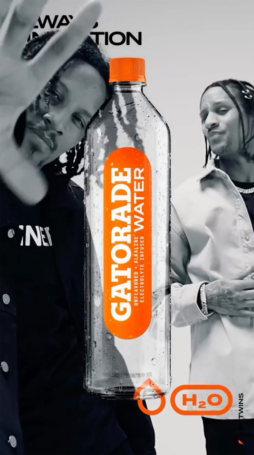 Two adult males flank a Gatorade Water bottle in a stylized product shot, featuring orange accents and monochrome processing.
