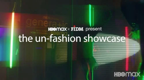 Promotional image for the 'Un-Fashion Showcase' with bright neon lights and visible brand logos. Genera+ion and HBOMax are visible.