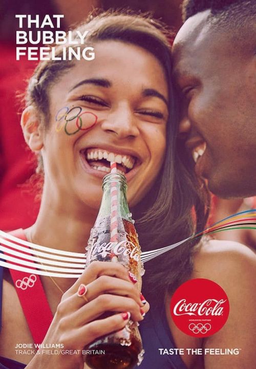 Smiling woman drinks Coca-Cola with Olympic rings facepaint, beside a Black man, with brand logos and text overlays in this promotional image.