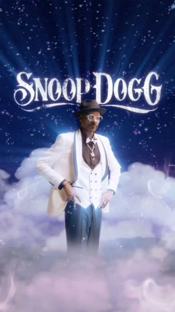 Snoop Dogg stands on a cloud wearing a white suit, fedora, and glasses, posing in front of a star-filled background with glowing lights.