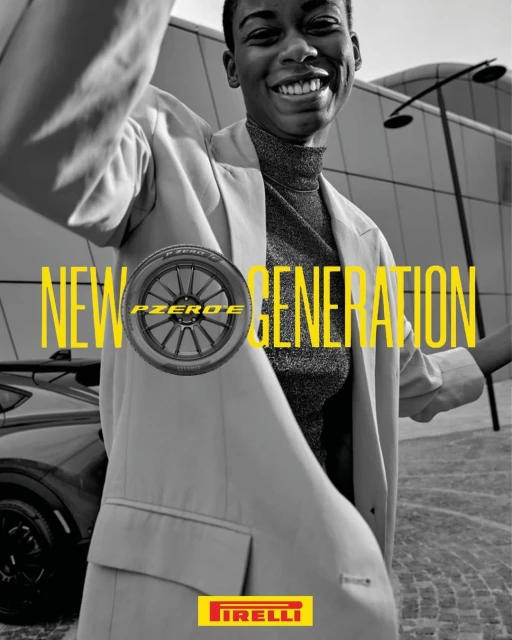 Pirelli tire advertisement featuring an adult woman in a suit standing in front of a car with yellow text overlay and the Pirelli logo.