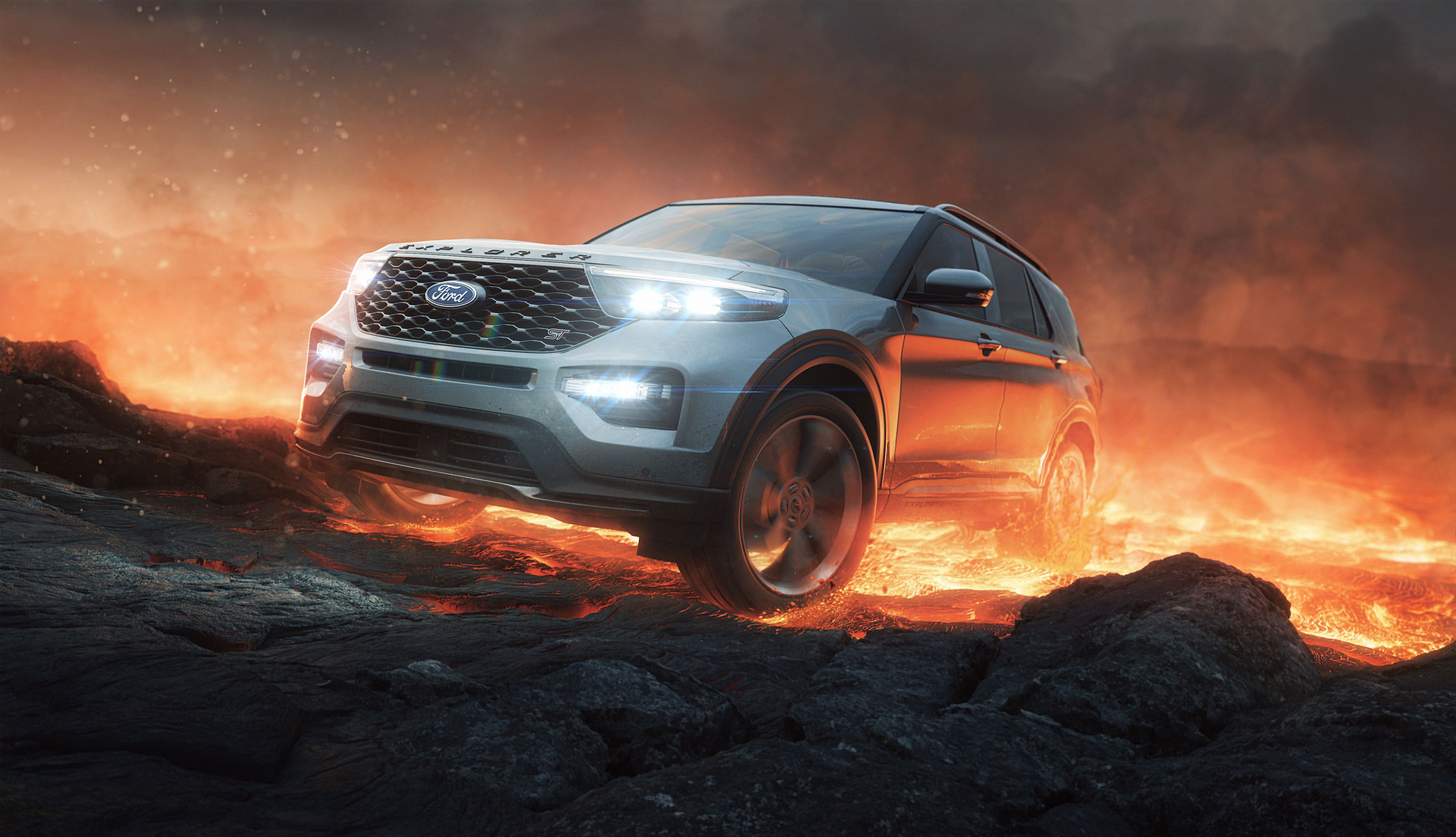 Silver Ford Explorer SUV drives over dark rocks with hot lava in the background. Automotive, outdoor, adventure, and transportation visual.